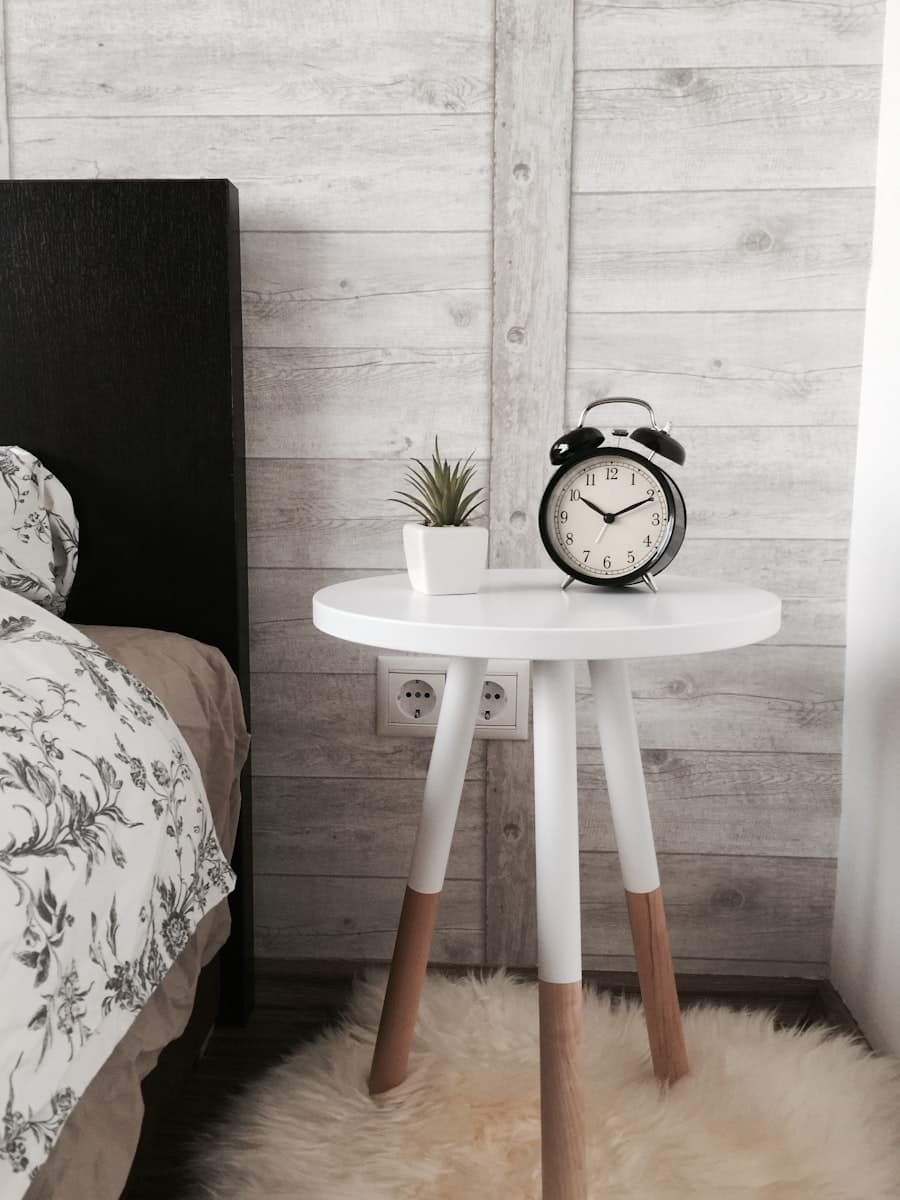 Cozy bedside detail with soft duvet and morning light