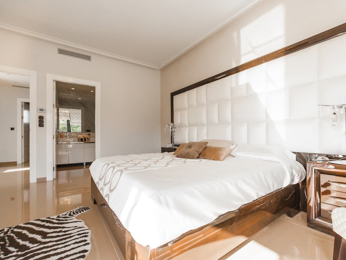 Elegant cream bedroom with a smooth tailored bed cover
