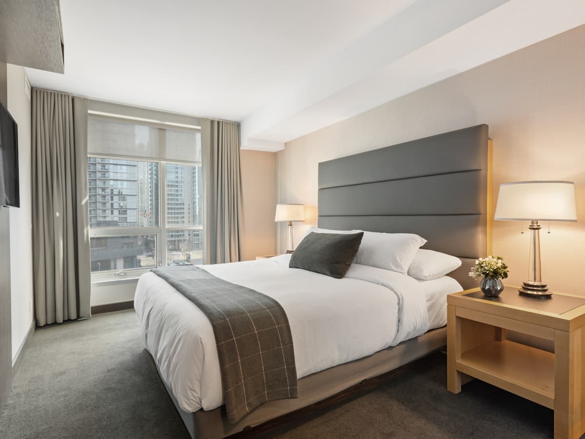 Premium mattress on a upholstered bed in a serene hotel bedroom